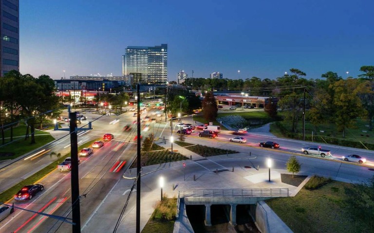 Houston Energy Corridor at twilight with traffic